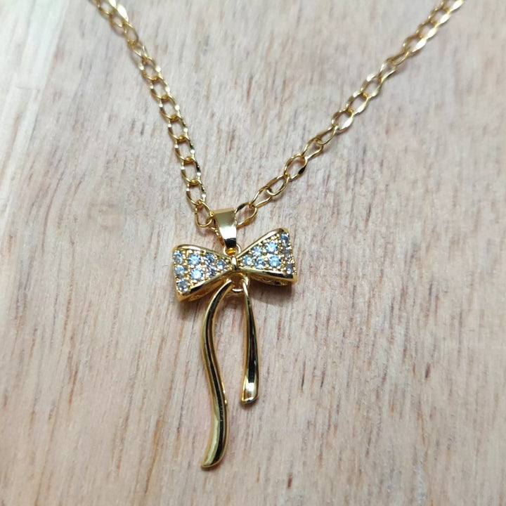 AD Bow Pendant in 18K Gold Plated Chain - Sparkleeng  Jewels